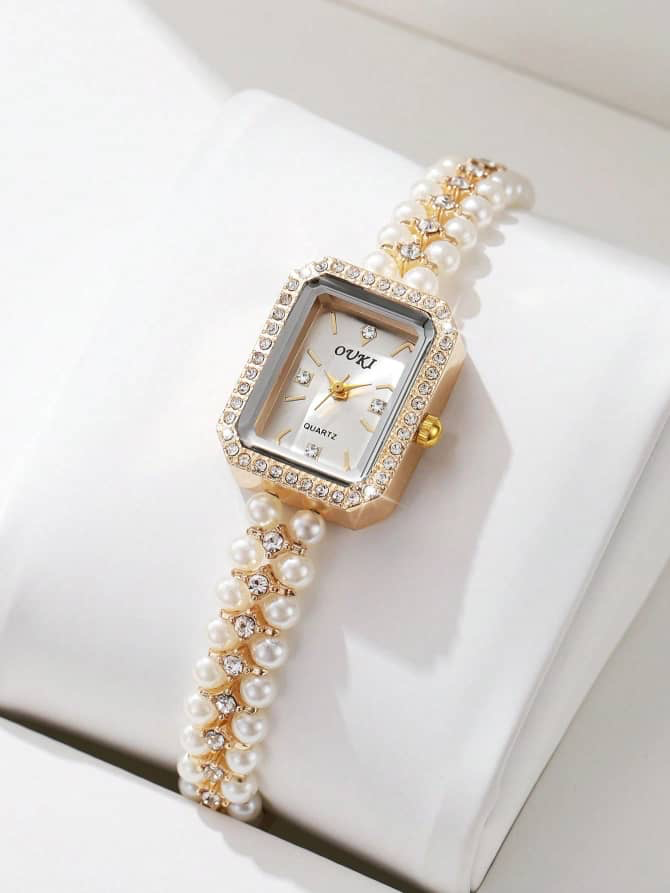 Montre femme « Ouki » à bracelet de perles et boîtier rectangulaire serti de strass